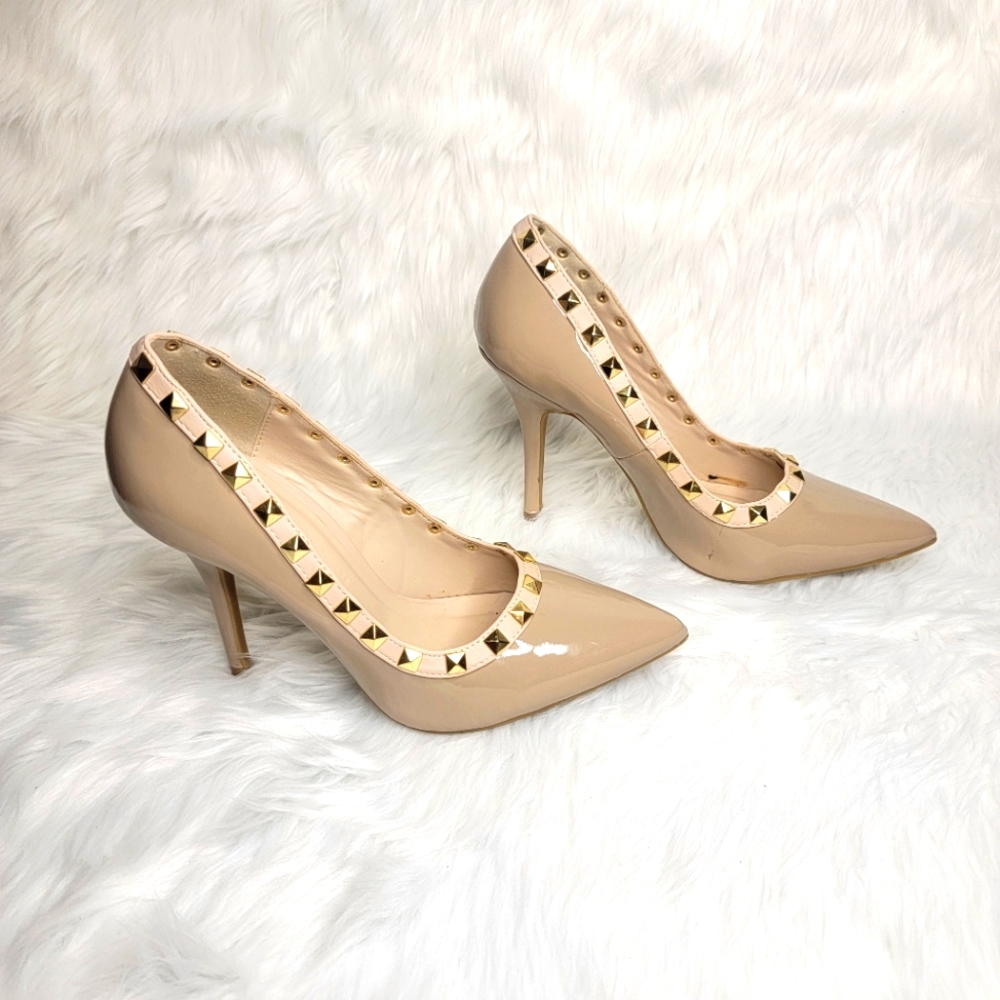 Nude patent leather heels gold studs.
